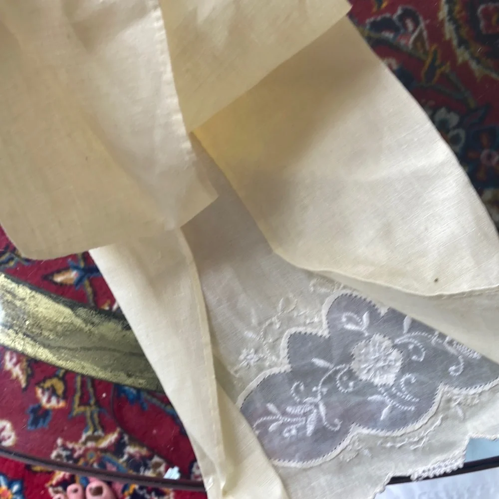 One fine linen embroidered tea towels. A muted butter yellow Vintage 1960s